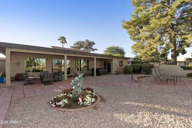 back of property featuring a patio