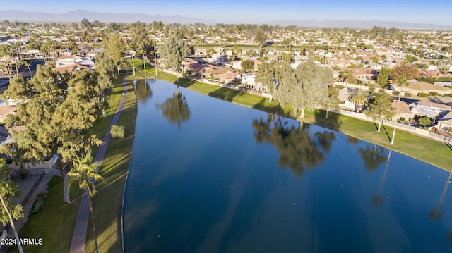 birds eye view of property featuring a water and mountain view