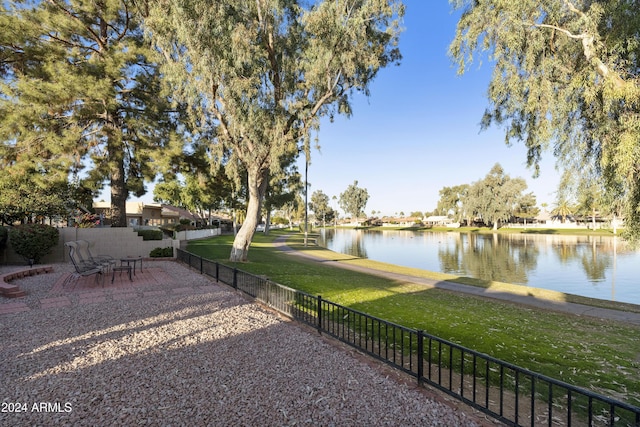 view of yard with a patio area and a water view