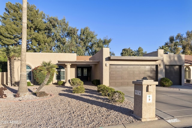 adobe home featuring a garage