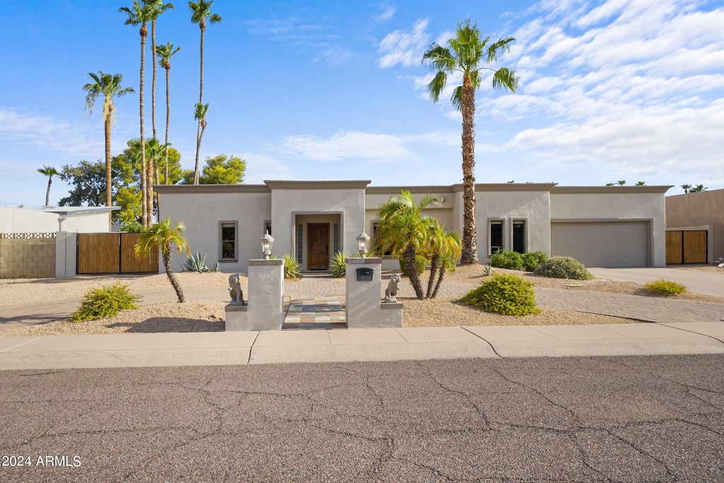 southwest-style home with a garage