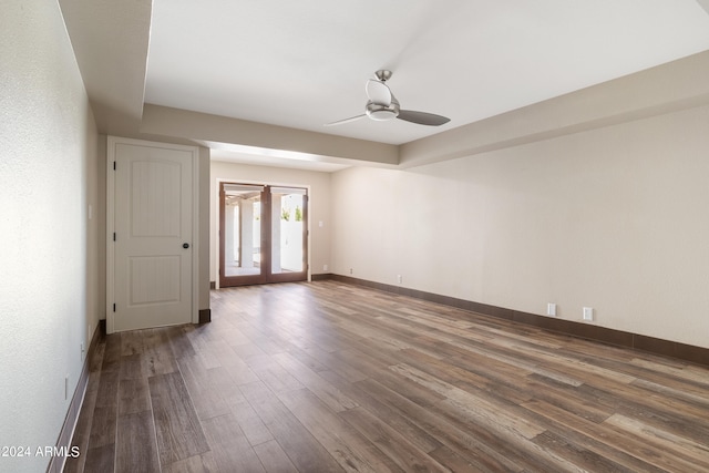 empty room with wood-type flooring, french doors, and ceiling fan