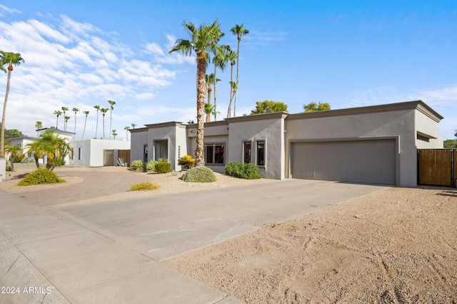 southwest-style home featuring a garage