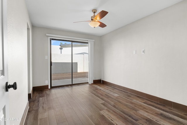 empty room with hardwood / wood-style flooring and ceiling fan