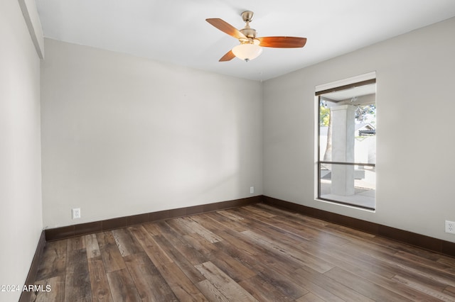 empty room featuring hardwood / wood-style flooring and ceiling fan