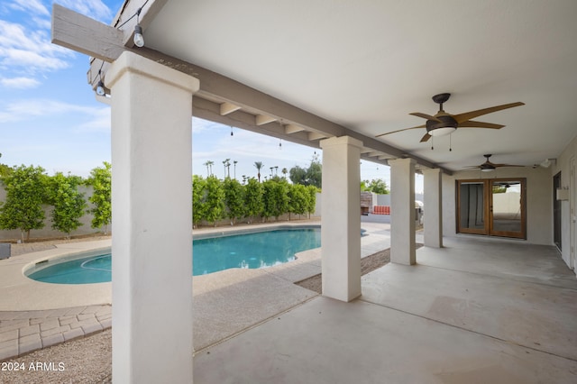 view of pool featuring a patio and ceiling fan