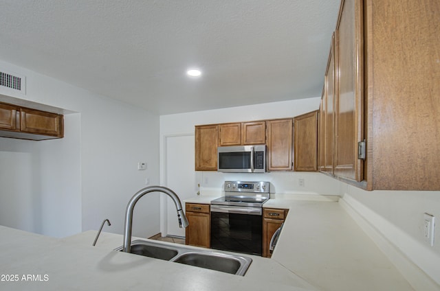 kitchen featuring appliances with stainless steel finishes and sink