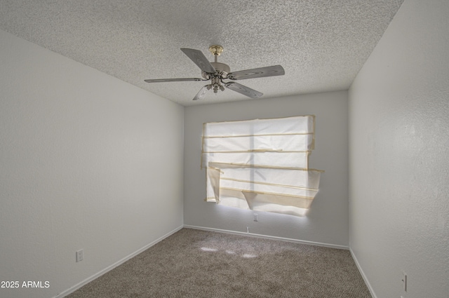 carpeted spare room with ceiling fan and a textured ceiling