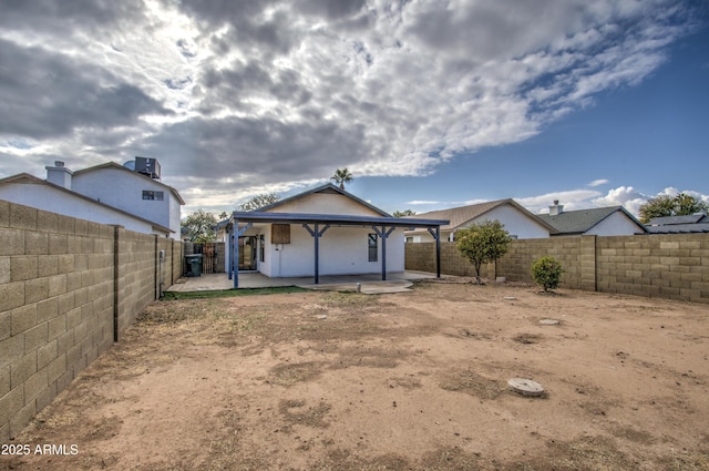 back of house with a patio