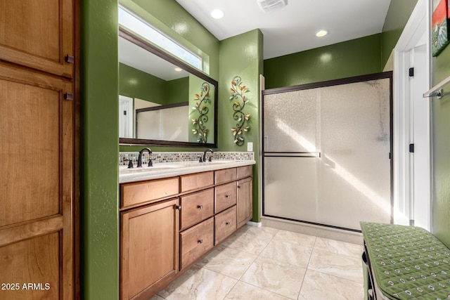 5083 W Buckskin Dr, Eloy, AZ 85131 - full bathroom with a stall shower, double vanity, recessed lighting, and a sink