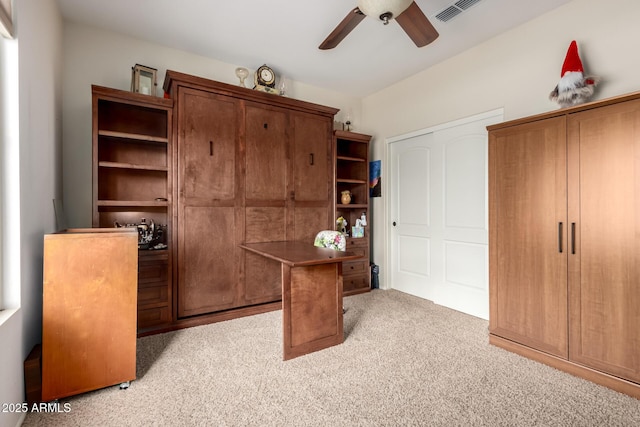 5083 W Buckskin Dr, Eloy, AZ 85131 - home office with a ceiling fan, light colored carpet, and visible vents