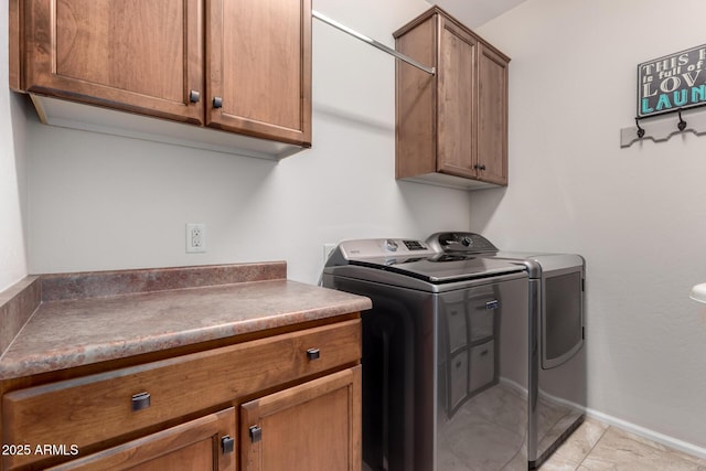 5083 W Buckskin Dr, Eloy, AZ 85131 - clothes washing area featuring baseboards, washer and dryer, and cabinet space