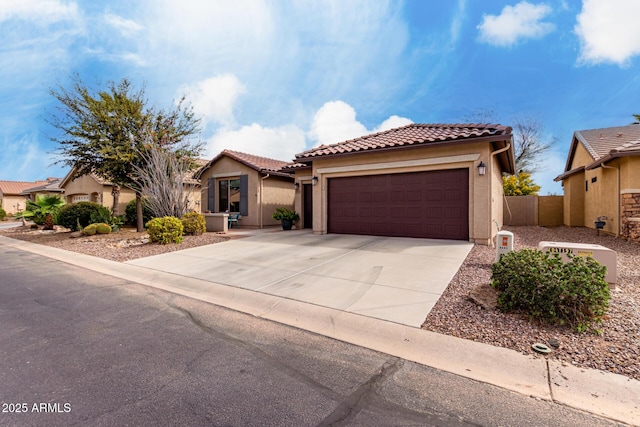 5083 W Buckskin Dr, Eloy, AZ 85131 - mediterranean / spanish house featuring driveway, an attached garage, a tiled roof, and stucco siding