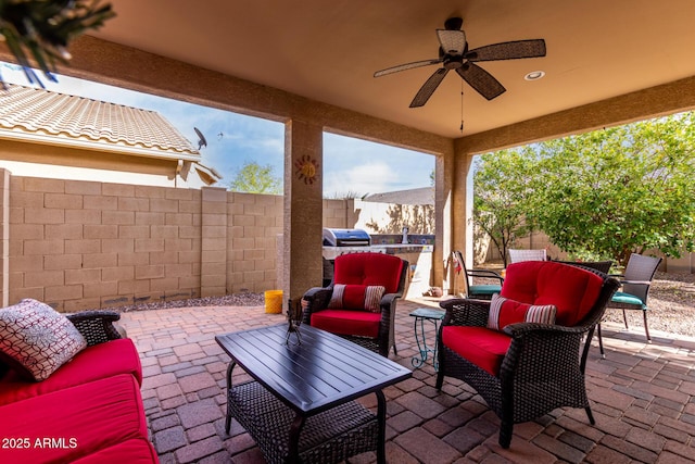 5083 W Buckskin Dr, Eloy, AZ 85131 - view of patio / terrace with a fenced backyard, an outdoor living space, and a ceiling fan