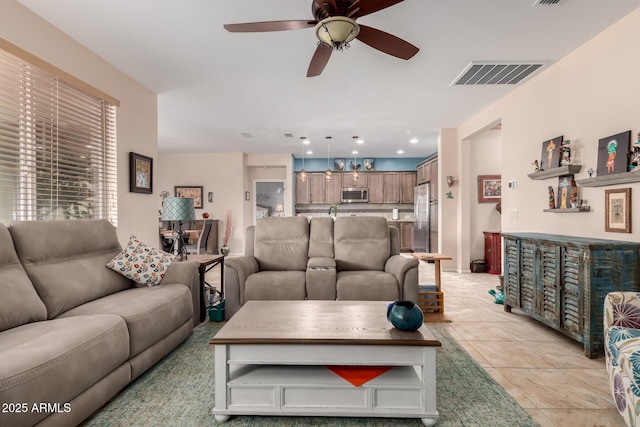 5083 W Buckskin Dr, Eloy, AZ 85131 - living area featuring light tile patterned floors, visible vents, recessed lighting, and a ceiling fan