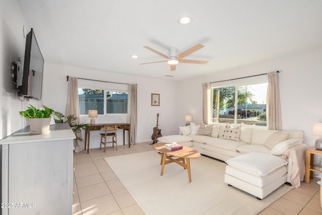 living area with light tile patterned flooring, recessed lighting, and ceiling fan