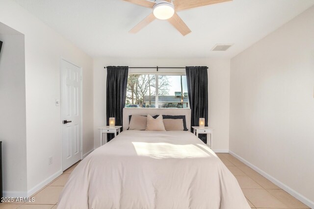 bedroom with light tile patterned floors, visible vents, ceiling fan, and baseboards