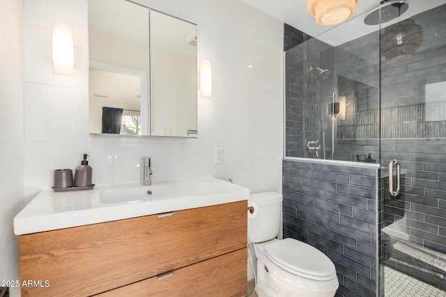 full bath featuring decorative backsplash, toilet, a shower stall, and vanity