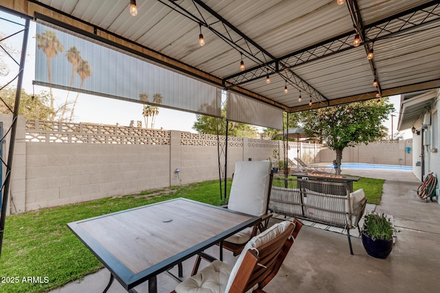 view of patio with a fenced in pool and a fenced backyard