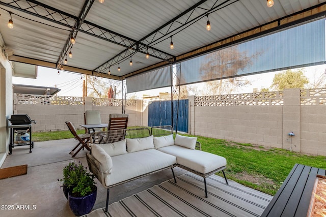 view of patio / terrace with an outdoor living space, area for grilling, outdoor dining area, and a fenced backyard