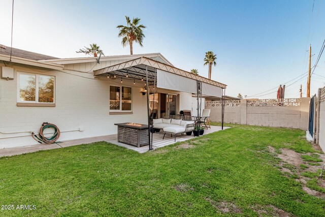 back of property featuring a fenced backyard, an outdoor living space, a patio, and a yard