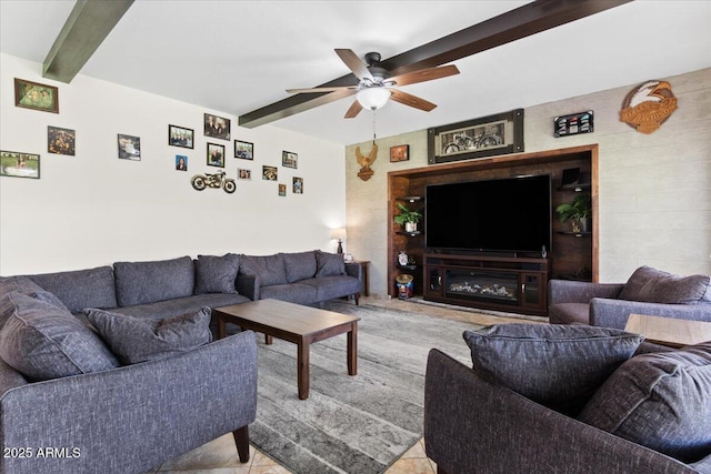 living room featuring beamed ceiling and ceiling fan