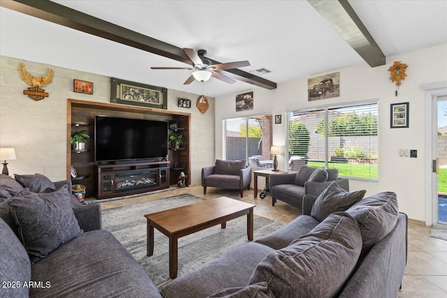 tiled living room with beam ceiling and ceiling fan