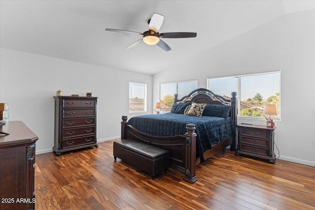 bedroom with lofted ceiling, multiple windows, dark hardwood / wood-style floors, and ceiling fan