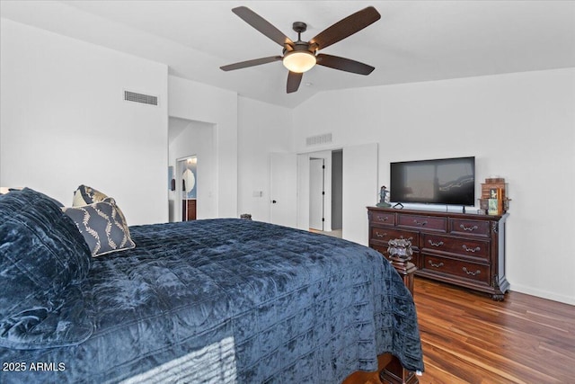 bedroom featuring ceiling fan, lofted ceiling, and dark hardwood / wood-style floors