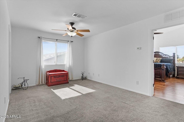 unfurnished room featuring carpet floors and ceiling fan