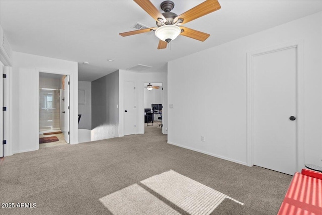 unfurnished bedroom with light colored carpet and ensuite bathroom