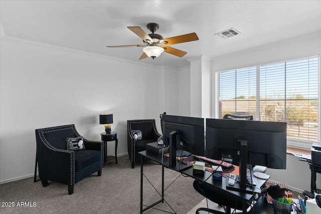 carpeted office space with crown molding and ceiling fan