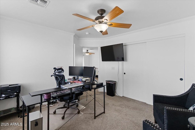 office area with ornamental molding, light carpet, and ceiling fan