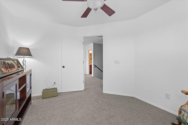 interior space featuring ceiling fan