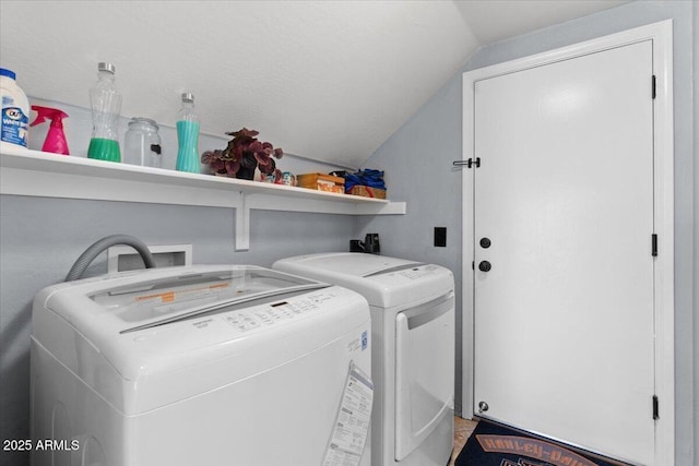 laundry area with washing machine and clothes dryer