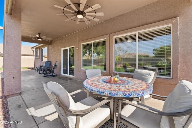 view of patio featuring ceiling fan