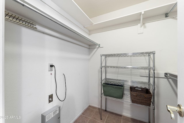 clothes washing area featuring tile patterned floors