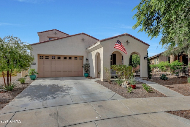 mediterranean / spanish-style home featuring a garage