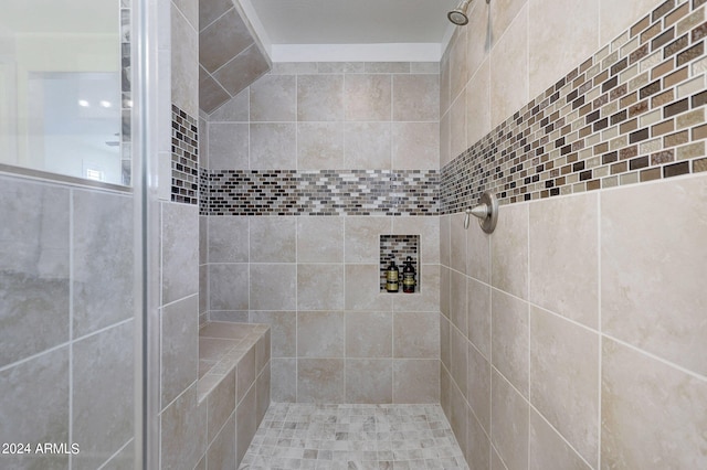 bathroom featuring tiled shower