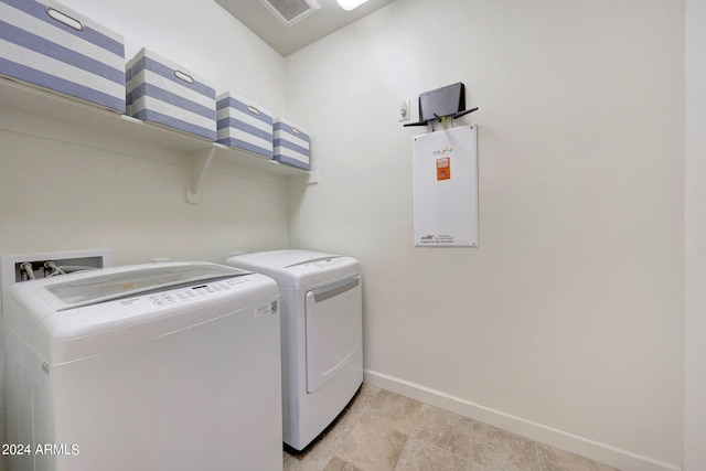 clothes washing area with washer and dryer