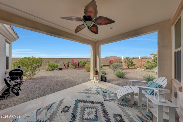 view of patio featuring ceiling fan