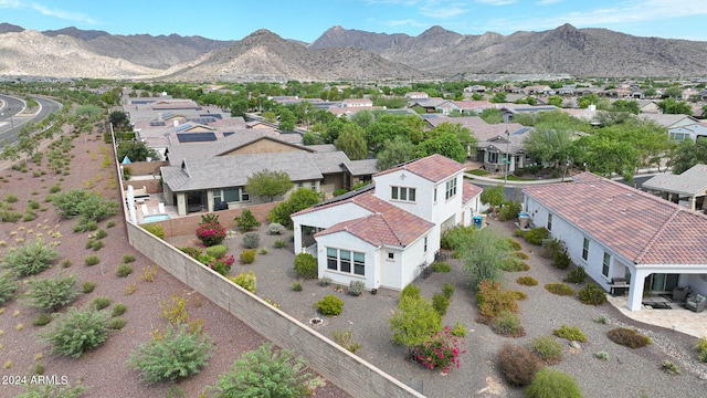 birds eye view of property with a mountain view