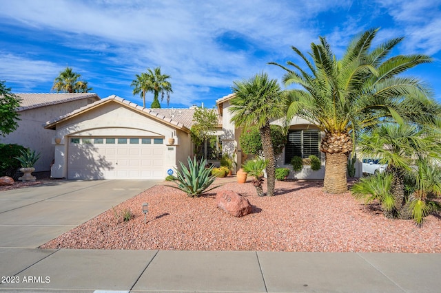 316 W Anderson Ave, Phoenix, AZ 85023 - view of front of house featuring driveway, a garage, stucco siding, and a tile roof