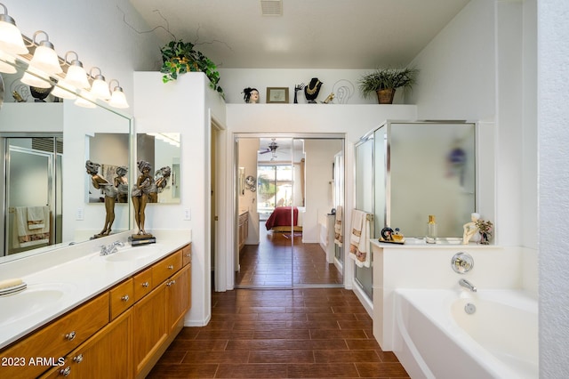 316 W Anderson Ave, Phoenix, AZ 85023 - ensuite bathroom featuring a shower stall, a bath, double vanity, and wood finished floors
