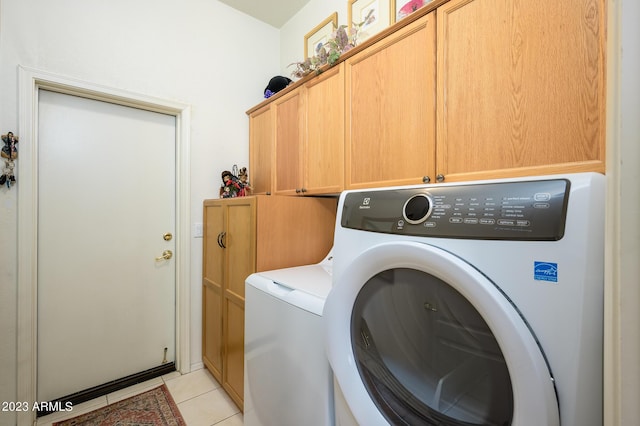 316 W Anderson Ave, Phoenix, AZ 85023 - laundry area with cabinet space, washing machine and clothes dryer, and light tile patterned flooring