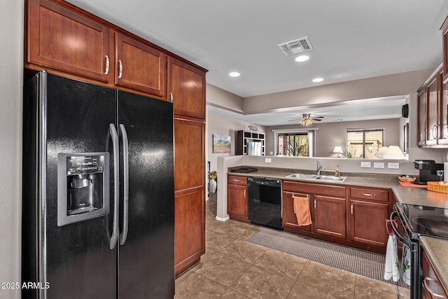 kitchen featuring ceiling fan, sink, and black appliances