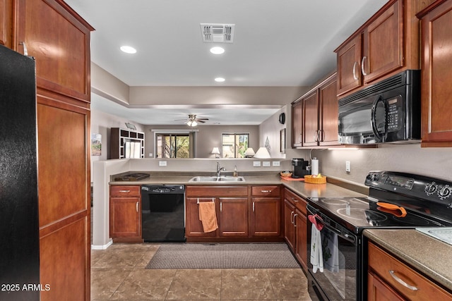 kitchen featuring ceiling fan, sink, and black appliances