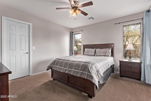 carpeted bedroom with ceiling fan