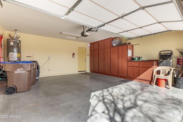 garage with a garage door opener and gas water heater