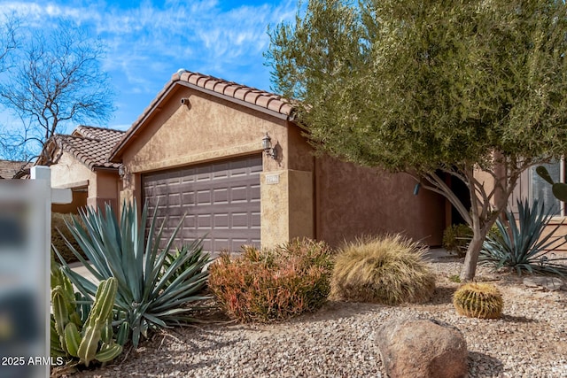 view of front of home with a garage